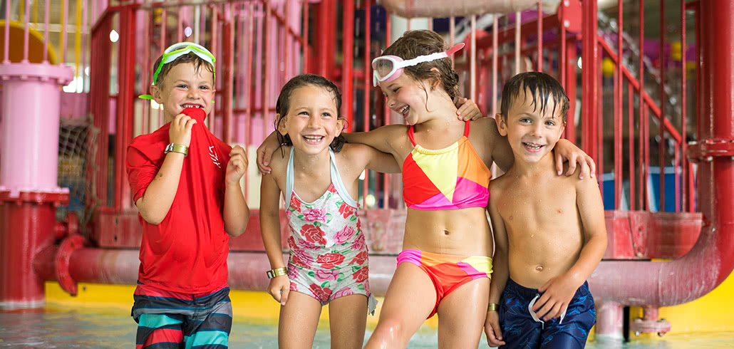 Kids laughing in kiddie Pool at water park
